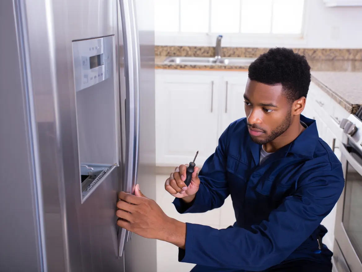 Professional Appliance Repair Technician Working on Dishwasher